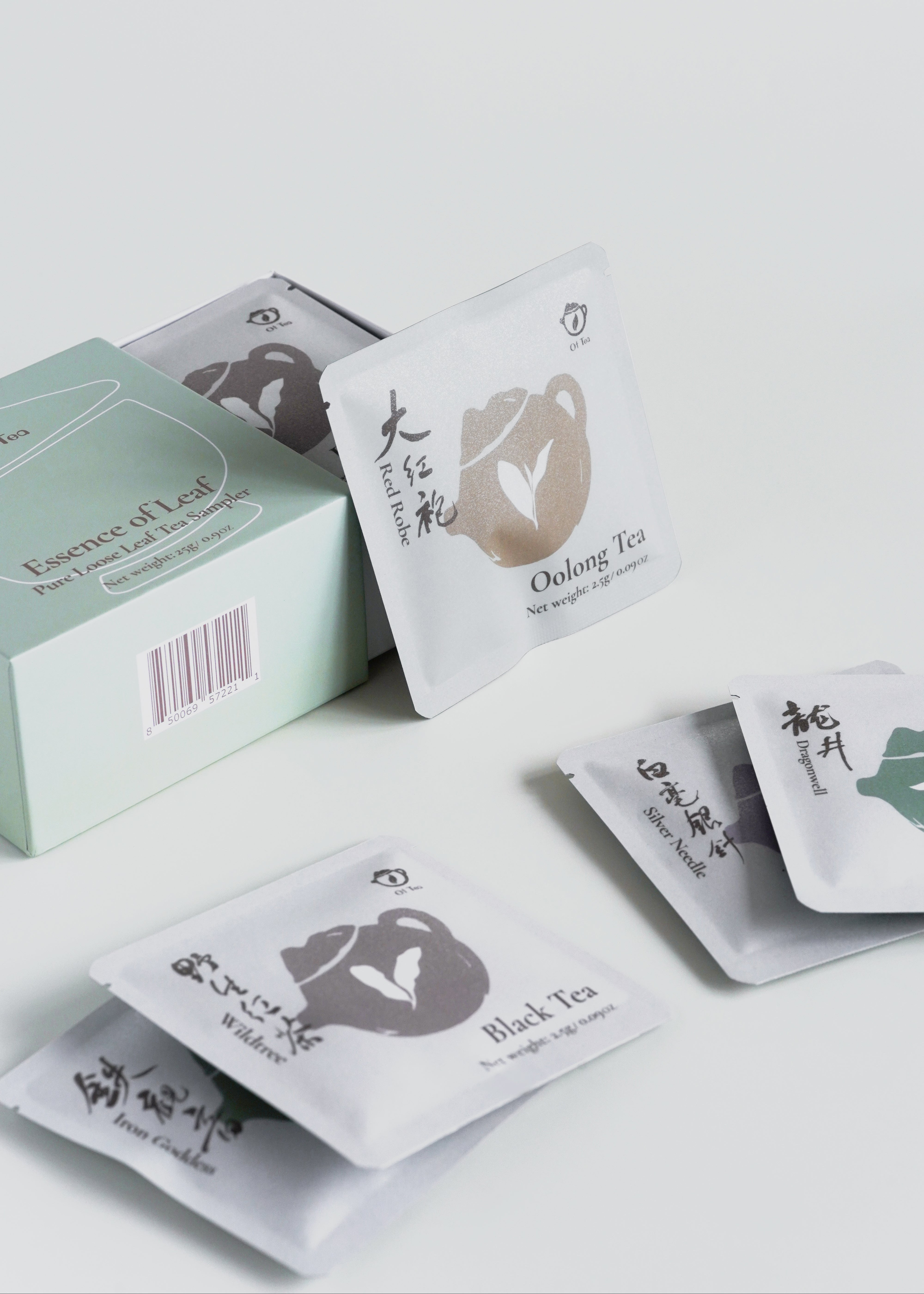 Tea bags with labels on a white surface