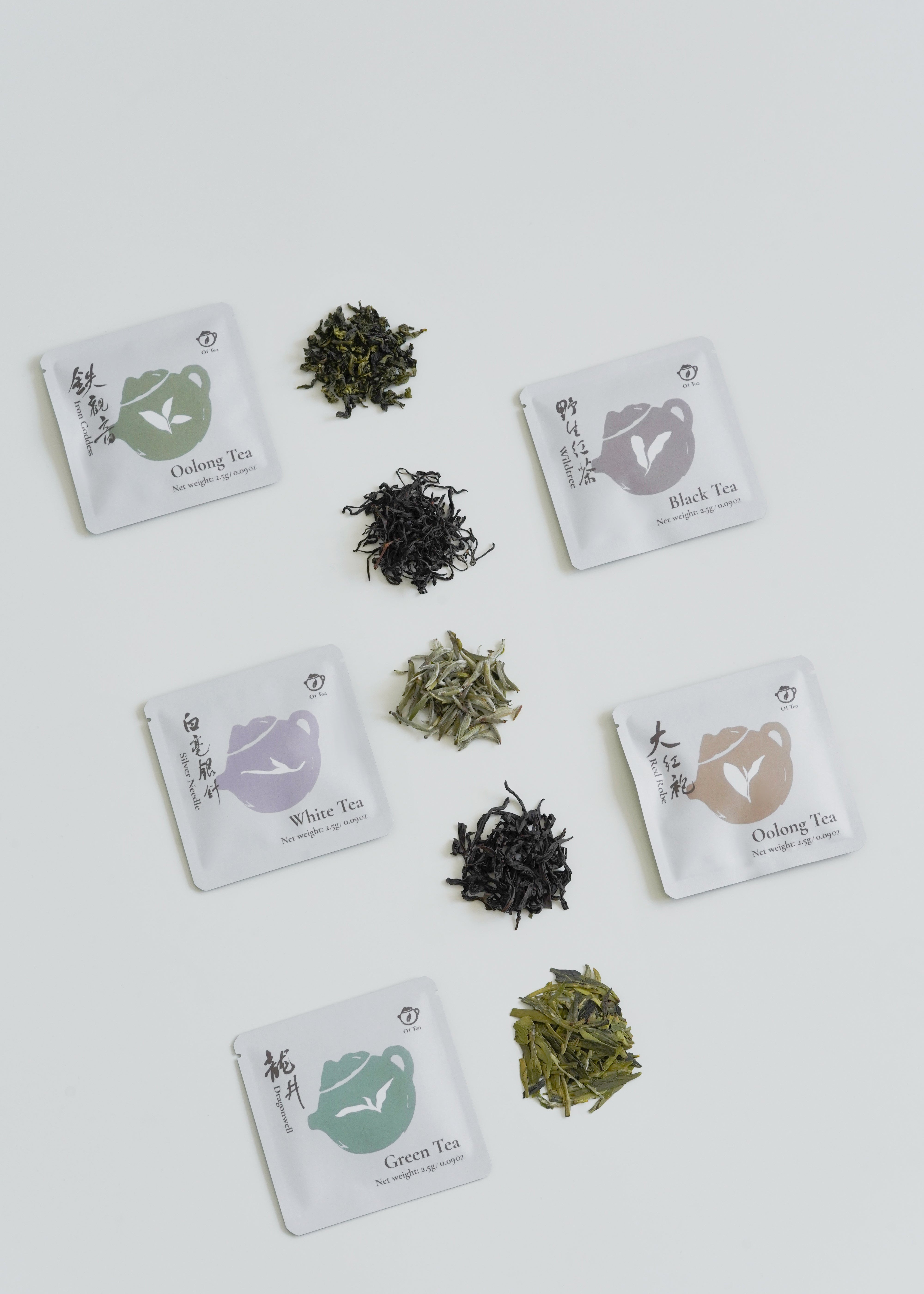 Tea packages with different types of tea leaves on a white background