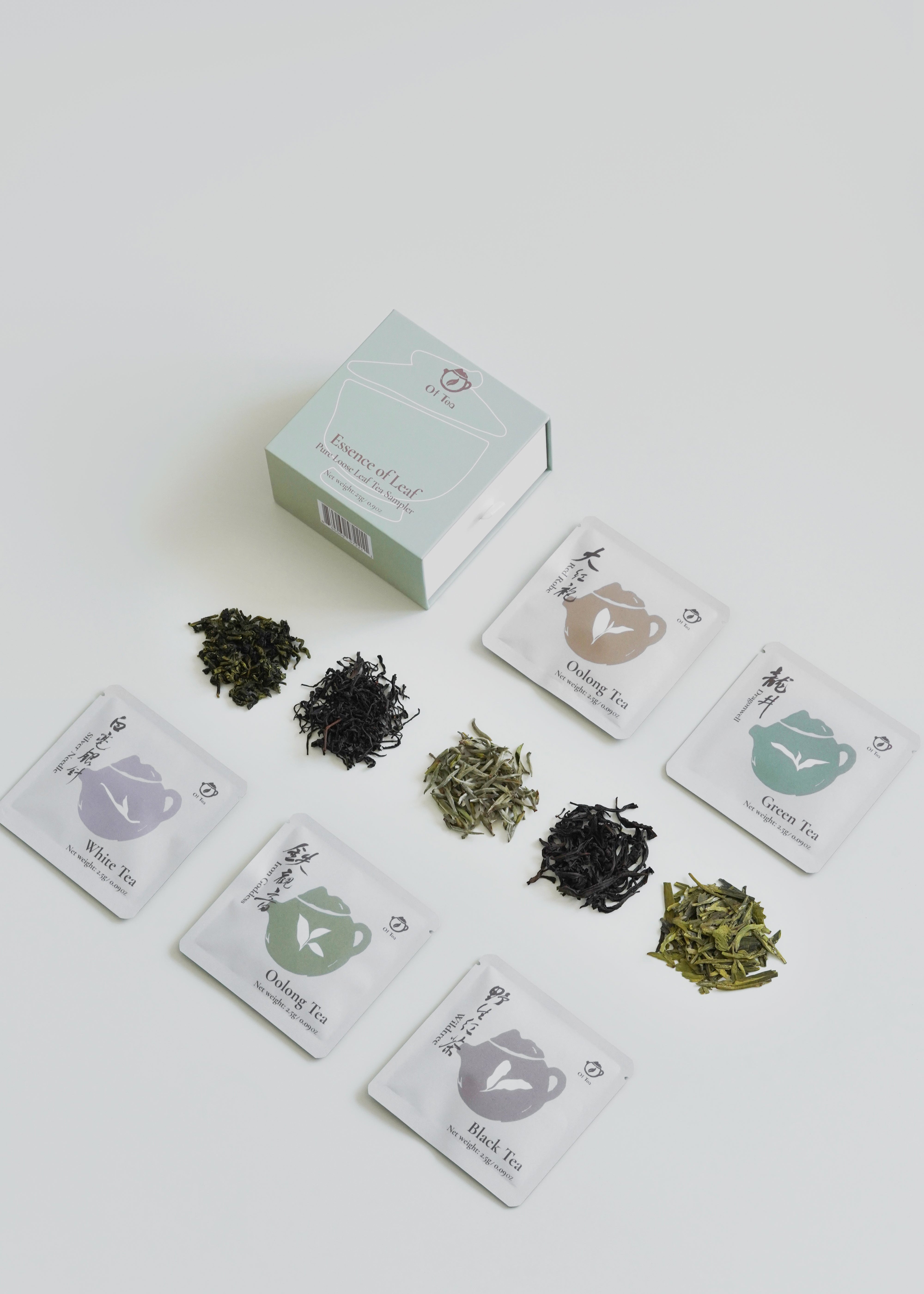 Tea packaging with various tea leaves on a white background